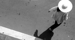 A woman in a white hat.