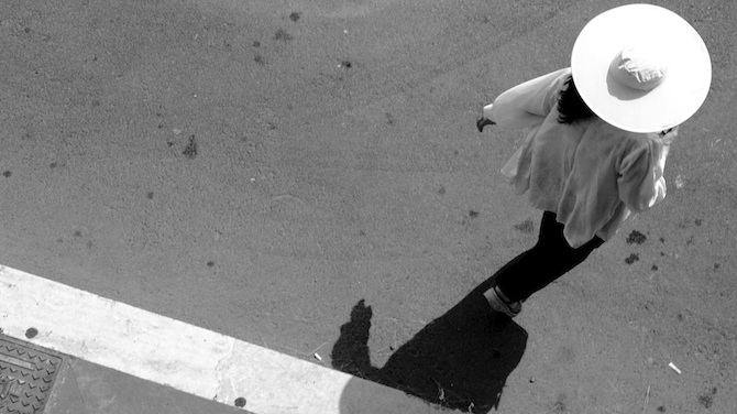 A woman in a white hat.