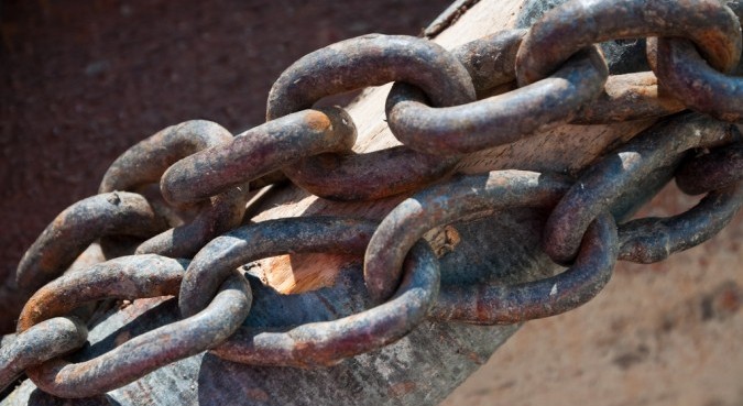 Close-up of large rusty chain links