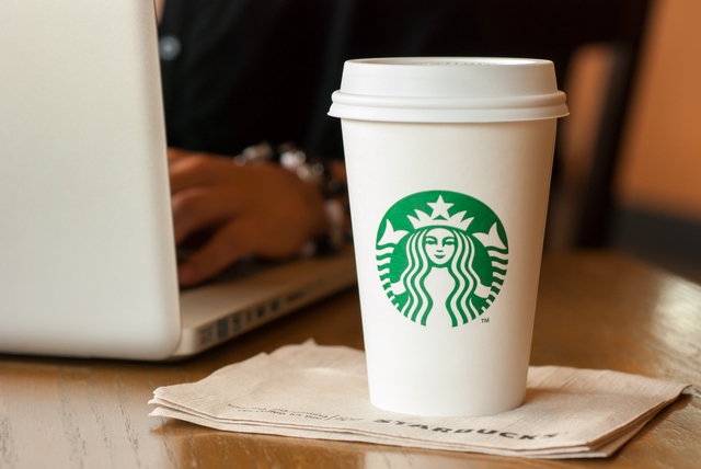 Developer drinking a cup of Starbucks