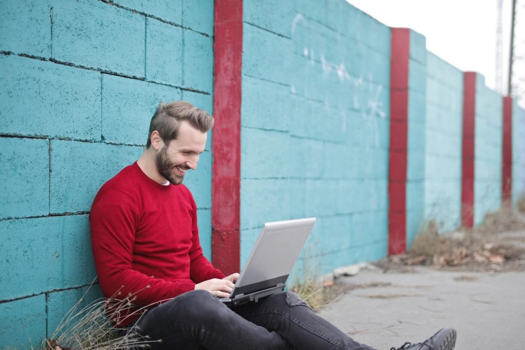 A man on a laptop.