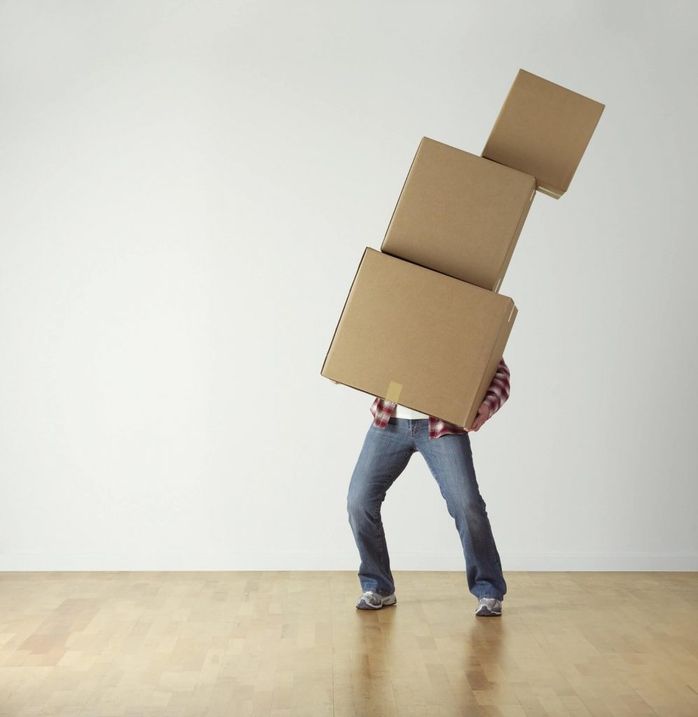 A man moving boxes.