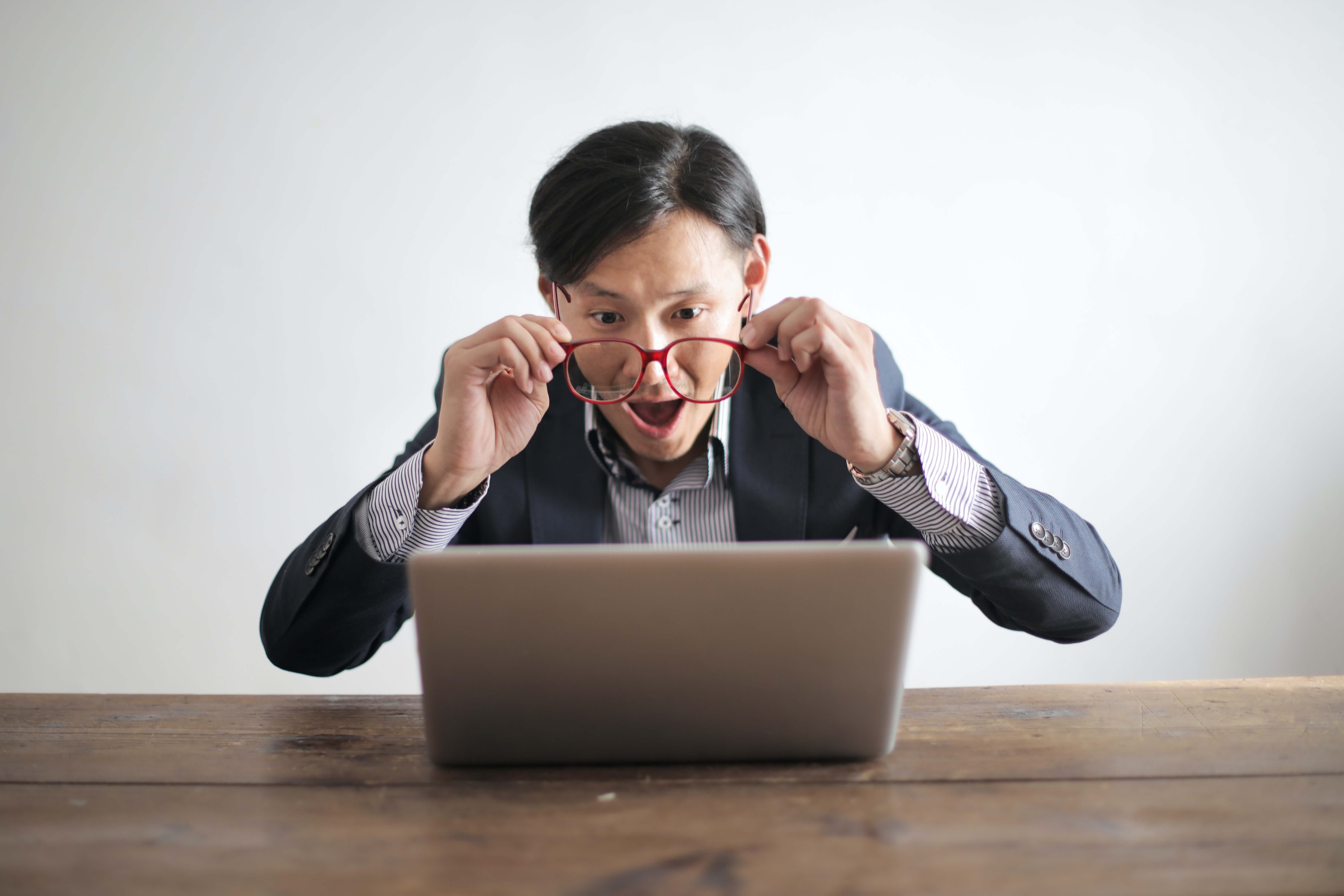 Surprised man with laptop,