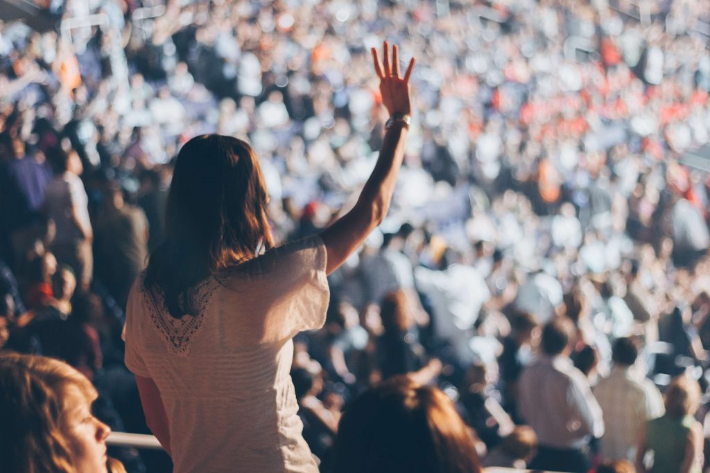 Person standing in a crowd.