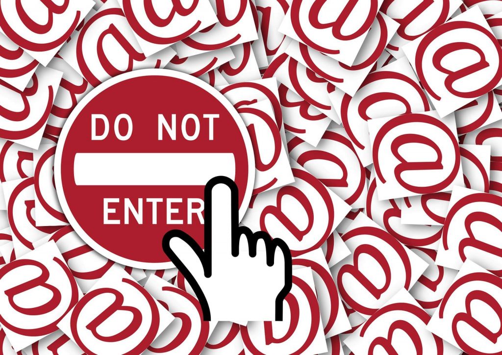 A cursor hovering over a "do not enter" sign, on top of a background of red "@" symbols.