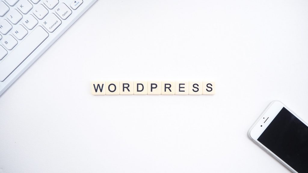 "WordPress" written in white blocks with black text.