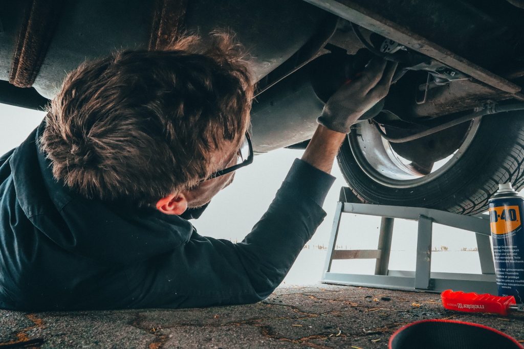 A mechanic working on a car.