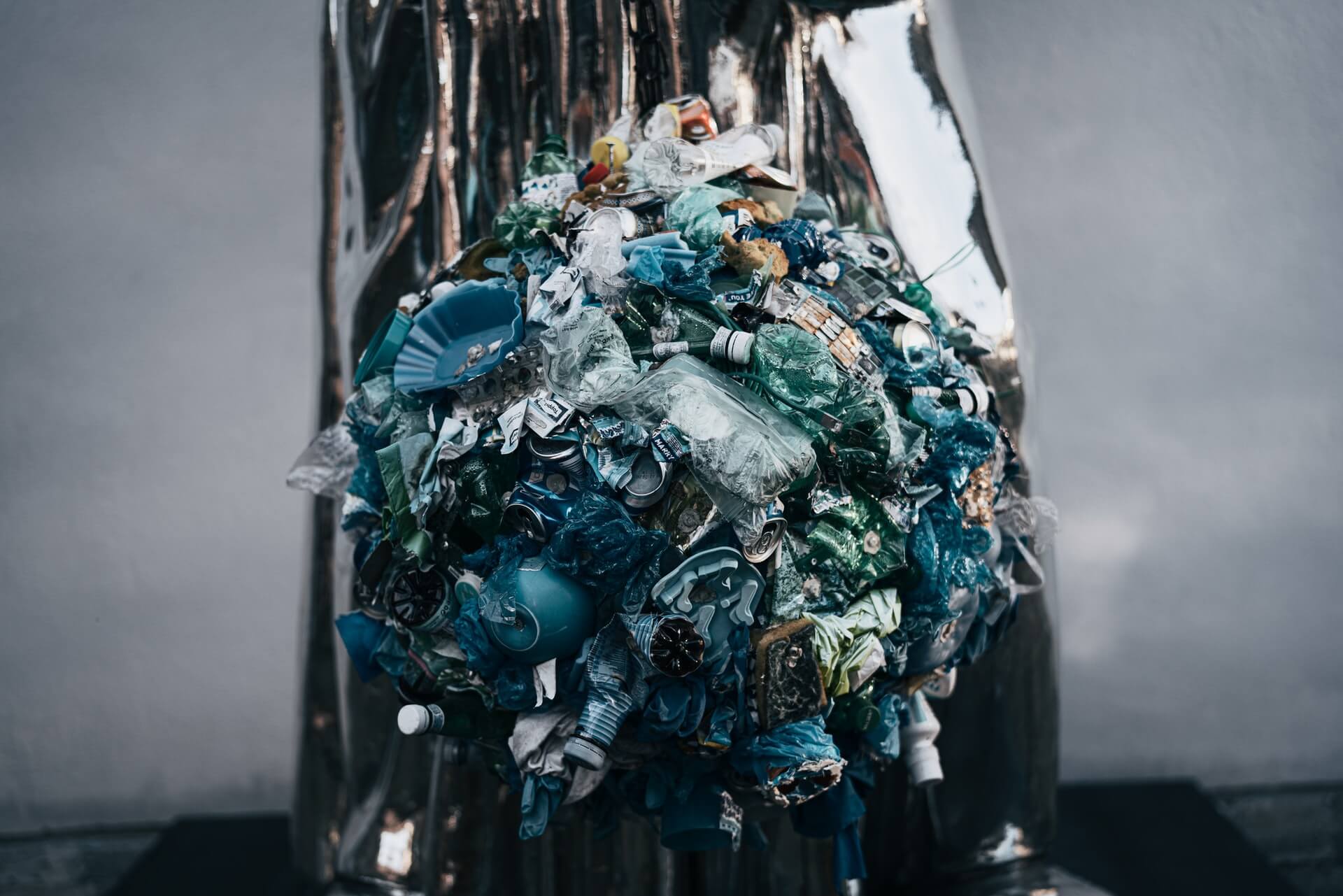 An overflowing rubbish bin.