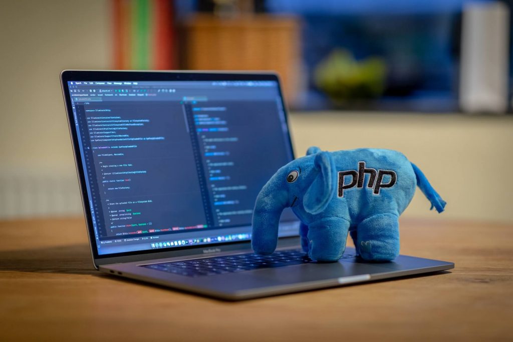A blue PHP elephant with a laptop.